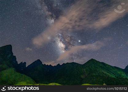 Fansipan mountain hills valley on summer with stars, milky way and paddy rice, agricultural fields at night, Sapa, Vietnam. Nature landscape background.