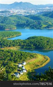 Fantastic landscape of eco lake for travel at Dalat, Viet Nam, fresh atmosphere, villa among forest, impression shape of hill and mountain from high view, wonderful vacation for ecotourism in spring