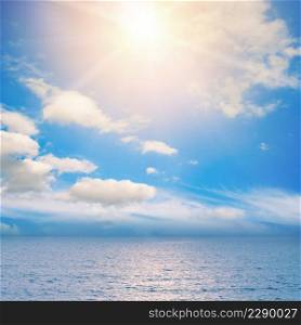 Fantastic landscape photo bright sun over blue ocean