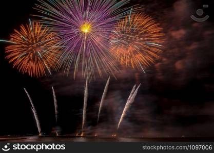 Fantastic Multicolor Firework Celebration from the big boat over the sea, celebration concept
