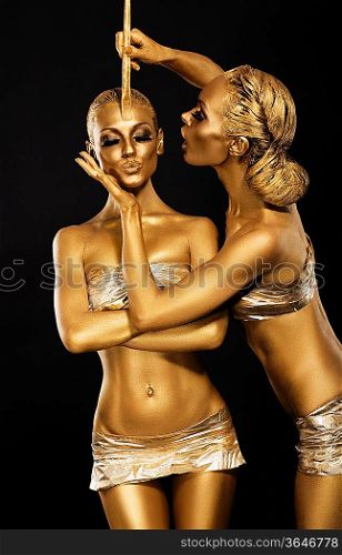 Fantasy. Creativity. Shiny Women&acute;s Gold Gilded Bodies. Arts