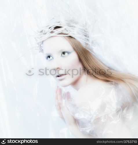 Fantasy ice queen theme, young beautiful woman, studio shot