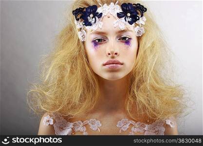 Fantasy. Portrait of Bright Blond with Unusual Makeup. Creativity