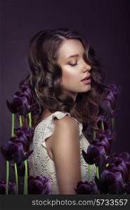 Fantasy. Portrait of Young Woman with Violet Tulips