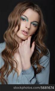 Fantasy. Young Brunette with Unusual Blue Eye Make-up