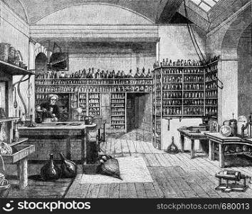 Faraday in his laboratory at the Royal Institution in London, vintage engraved illustration. From the Universe and Humanity, 1910.
