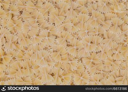 Farfalle pasta as a texture background.. Farfalle pasta as a texture background