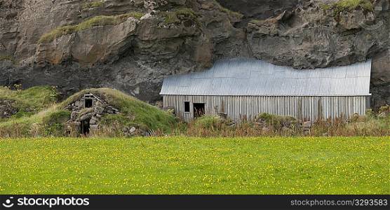 Farm buildings buried under volcanic rock