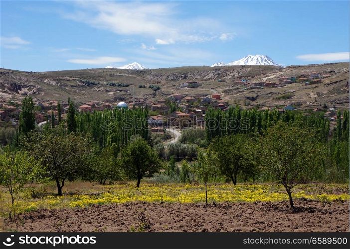 Farm fields and village in Ihlara valley in Cappadocia, Turkey