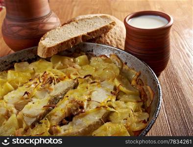 farm-style country Codfish with potatoes and onions baked