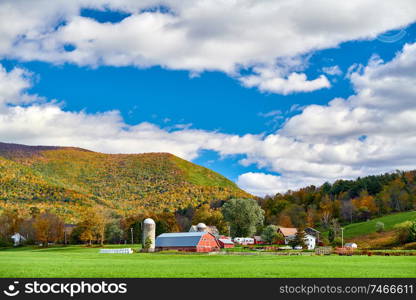 Farm with red barn and silos at sunny autumn day in West Arlington, Vermont, USA