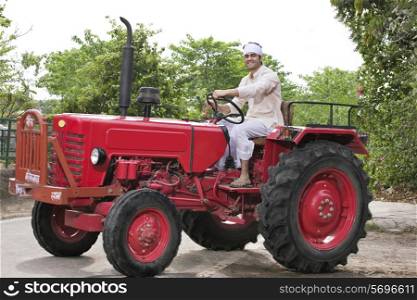 Farmer on a tractor smiling