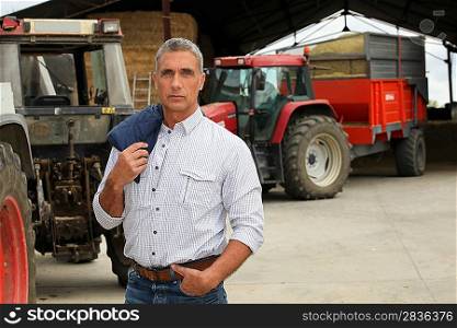 Farmer stood in front of tractors
