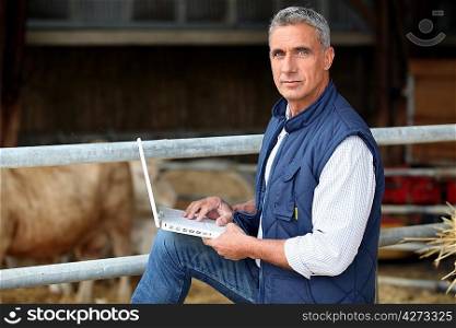 farmer working on his laptop