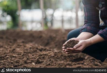 Farmers&rsquo; expert hands check soil health before planting vegetable seeds or seedlings. Business idea or ecology