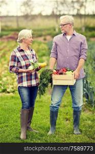 farming, gardening, agriculture, harvesting and people concept - senior couple with box of vegetables at farm. senior couple with box of vegetables on farm