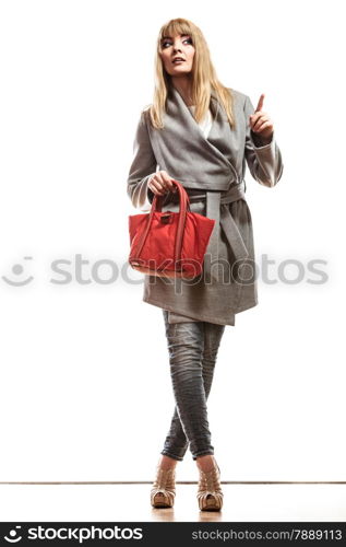 Fashion and advertisement concep t.Full body woman elegant gray belt coat holding red handbag pointing copy space empty blank isolated