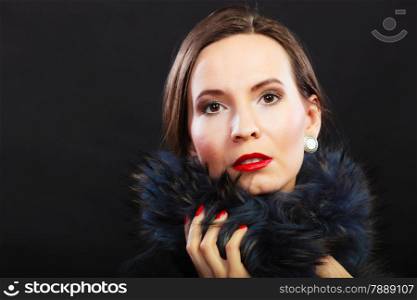 Fashion and beauty. Woman in fur coat red lips and nails, lady retro style portrait on black background