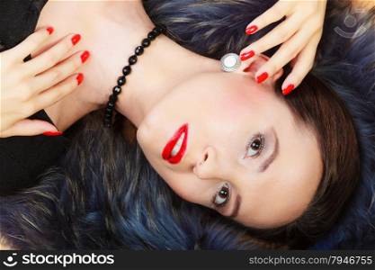 Fashion and beauty. Woman in fur coat red lips and nails, lady retro style portrait