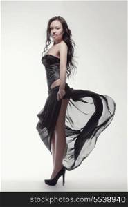 fashion and people concept - gorgeous asian woman in black dress