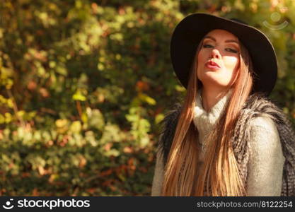 Fashion and style of female. Attractive and fashionable woman outdoor. Portrait of charming young lady resting on air in park.. Pretty girl in park