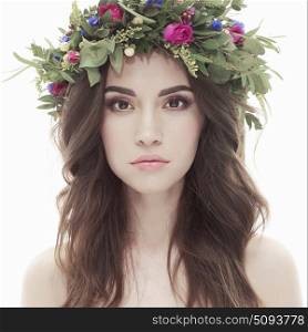Fashion art photo of beautiful lady in flower diadem. Spring/Summer. Beautiful lady in flower diadem