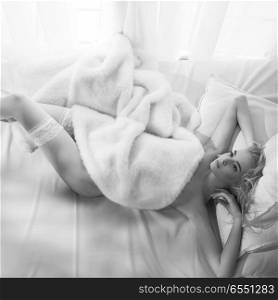 Fashion art photo of beautiful sensual woman in white stockings in her boudoir. Home bedroom interior. Beautiful morning. Summer sunset. Bridal moments                             