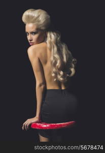 Fashion-art photo of elegant blonde on black background