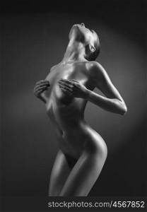 fashion art photo of sexy nude stripper with perfect body. Perfect female body with oil skin