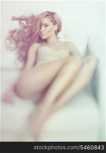 Fashion art photo of young sensual lady in white interior