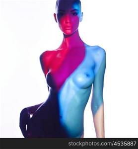 Fashion art studio photo of elegant naked lady with color shadows on her body
