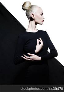 Fashion art studio portrait of elegant blode in geometric black and white background