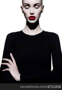 Fashion art studio portrait of elegant woman with red lips. Fashionable lipstick. Professional cosmetic. Portrait of beauty in black dress with big sexy lips. Very beautiful lips.
