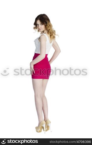 Fashion beautiful girl with modern white blouse and res skirt posing in studio, isolated on white