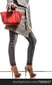 Fashion beauty and elegance concept. fashionably woman elegant gray belt coat holding red handbag isolated on white