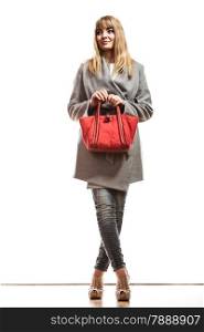 Fashion beauty and elegance concept. Full body fashionably woman elegant gray belt coat holding red handbag isolated on white