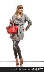 Fashion beauty and elegance concept. Full body fashionably woman elegant gray belt coat holding red handbag isolated on white