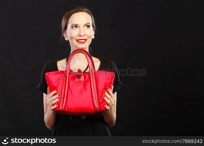 Fashion beauty and elegance concept. Woman retro style. Elegant lady black dress holding red handbag