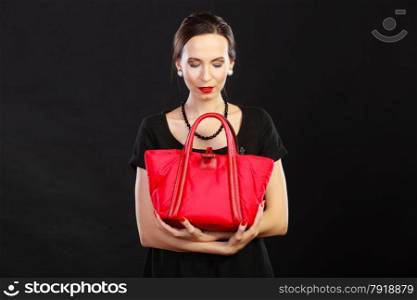 Fashion beauty and elegance concept. Woman retro style. Elegant lady black dress holding red handbag