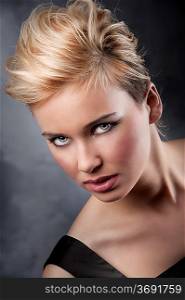 fashion beauty portrait of young blond girl with creative hair stylish on dark background