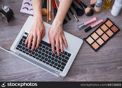 Fashion blogger with make-up accessories