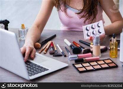 Fashion blogger with make-up accessories