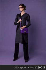 Fashion business beautiful woman with accessories on purple background