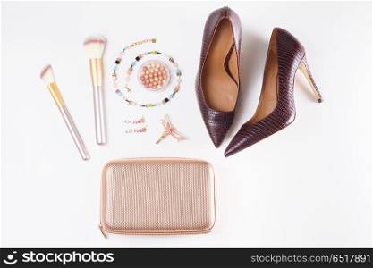 Fashion Christmas flat lay scene. Fashion flat lay scene. Hight heel shoes, bag, dressing up for party fashion accessoires.