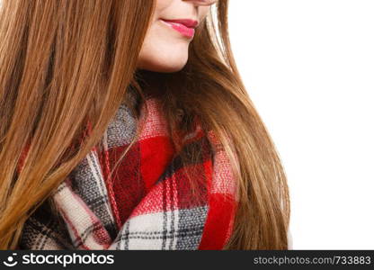 Fashion, clothes and clothing concept. Woman feeling cold wearing warm scarf warming herself up. Woman feeling cold wearing warm scarf