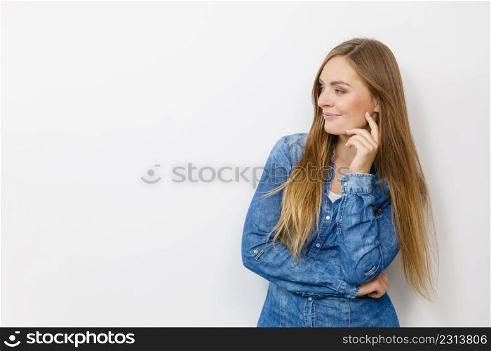 Fashion, clothing, people concept. Attractive young woman with jeans jacket. Girl is posing in the studio.. Beautiful young lady with denim jacket.