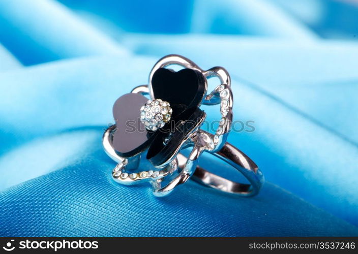 Fashion concept with ring on background