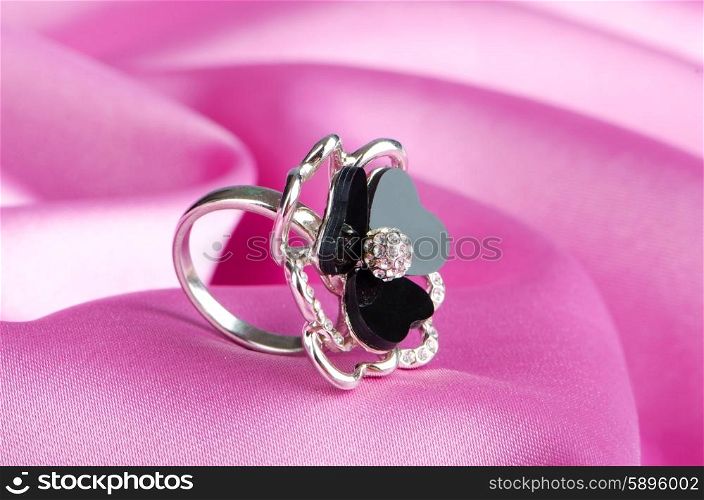 Fashion concept with ring on background