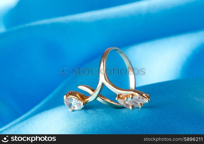 Fashion concept with ring on background