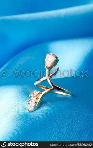 Fashion concept with ring on background